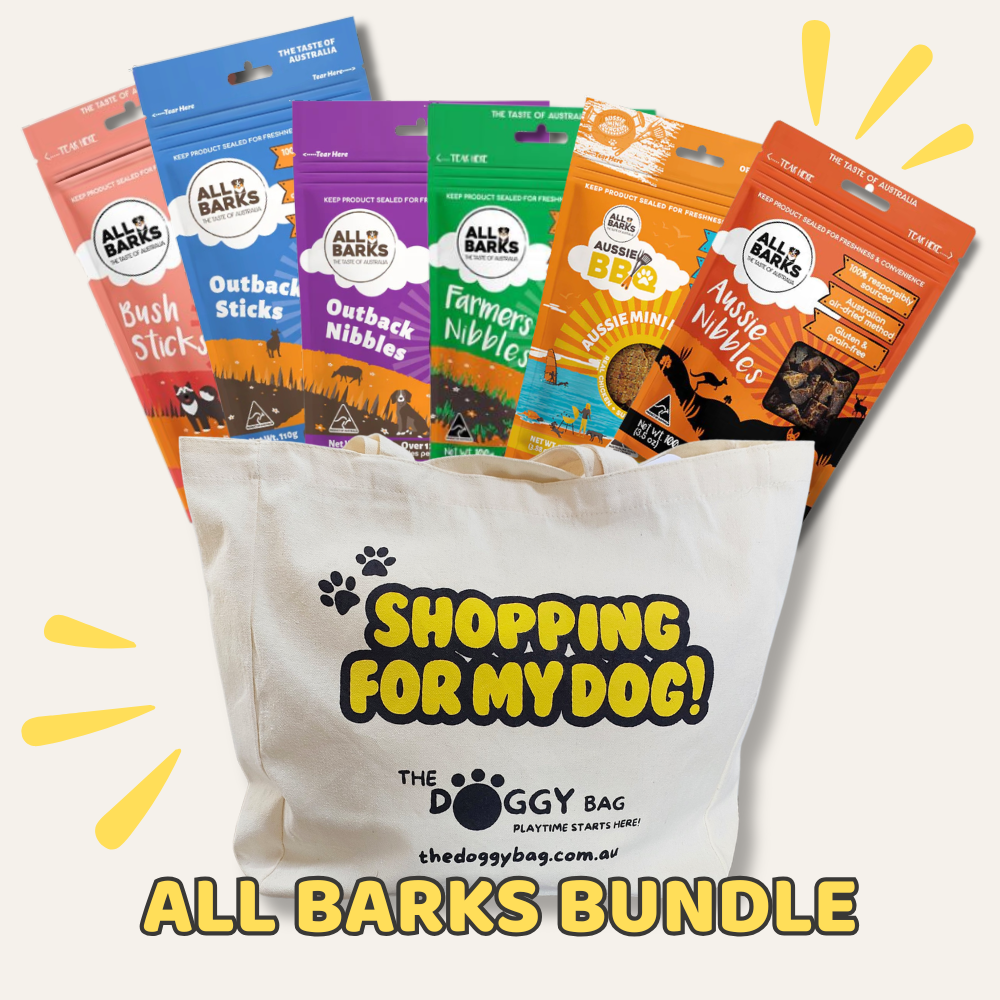 Collection of All Barks dog treat packages with a 'Shopping for My Dog!' bag in the foreground.