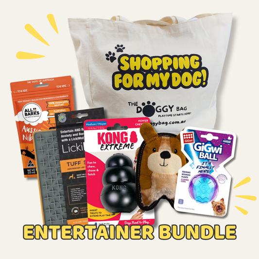Dog entertainment bundle with toys and treats on a white background