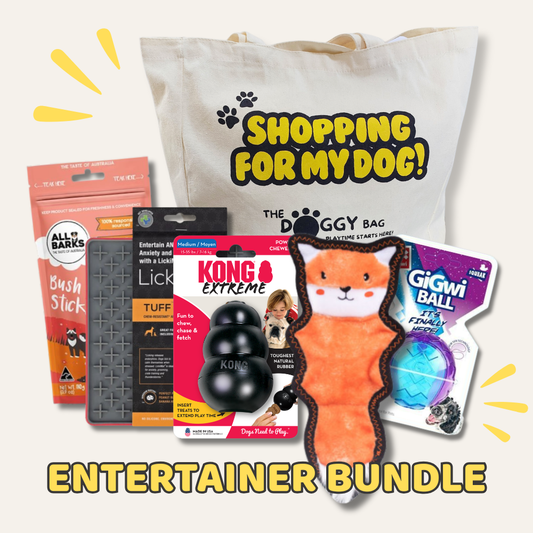 Dog entertainment bundle with toys and treats on a white background