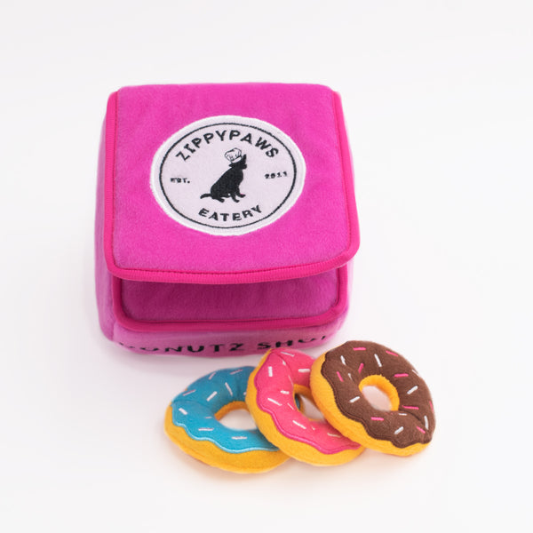 Zippy Paws interactive hide and seek boredom busting burrow dog toy. Comes with 3 squeaky plush donut dog toys. Help fight boredom in your dog. Great dog birthday present.
