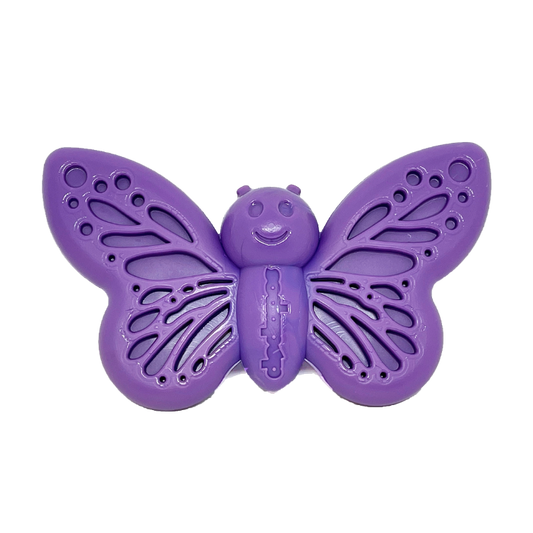 A purple butterfly-shaped dog chew toy with holes for chewing and a central butterfly face with eyes and antennae.